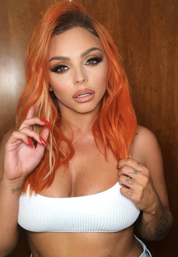 Jessy Nelson Flaunts Vibrant Orange Hair Background
