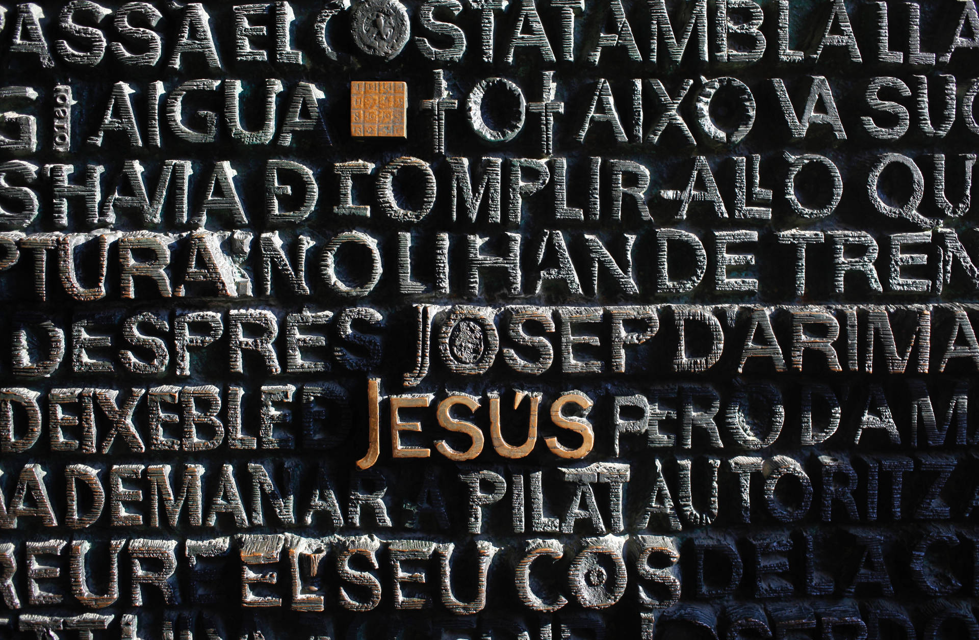 Jesus Christ Shines Through Inscribed Wall Background