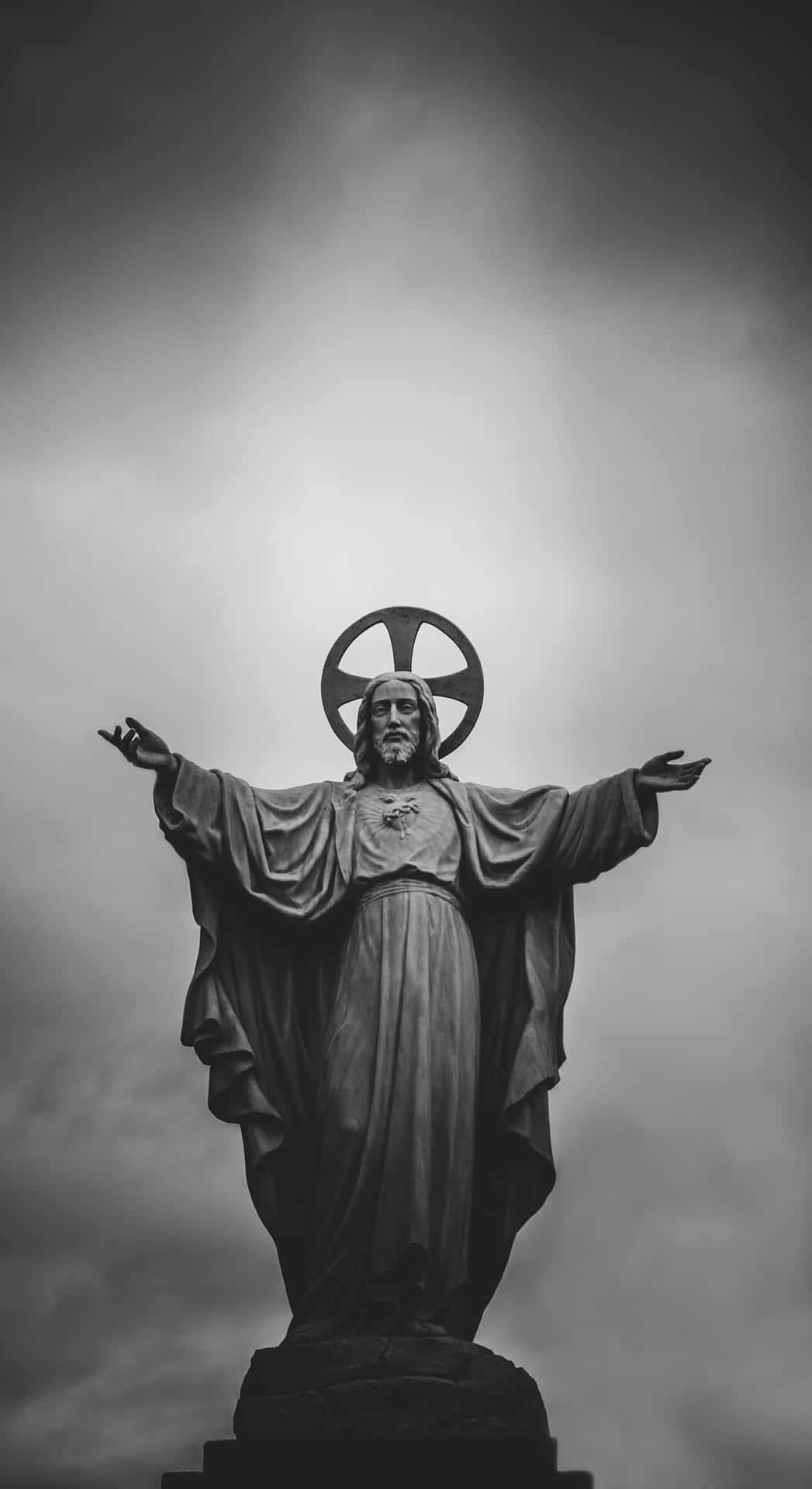 Jesus Is King Stone Statue Background