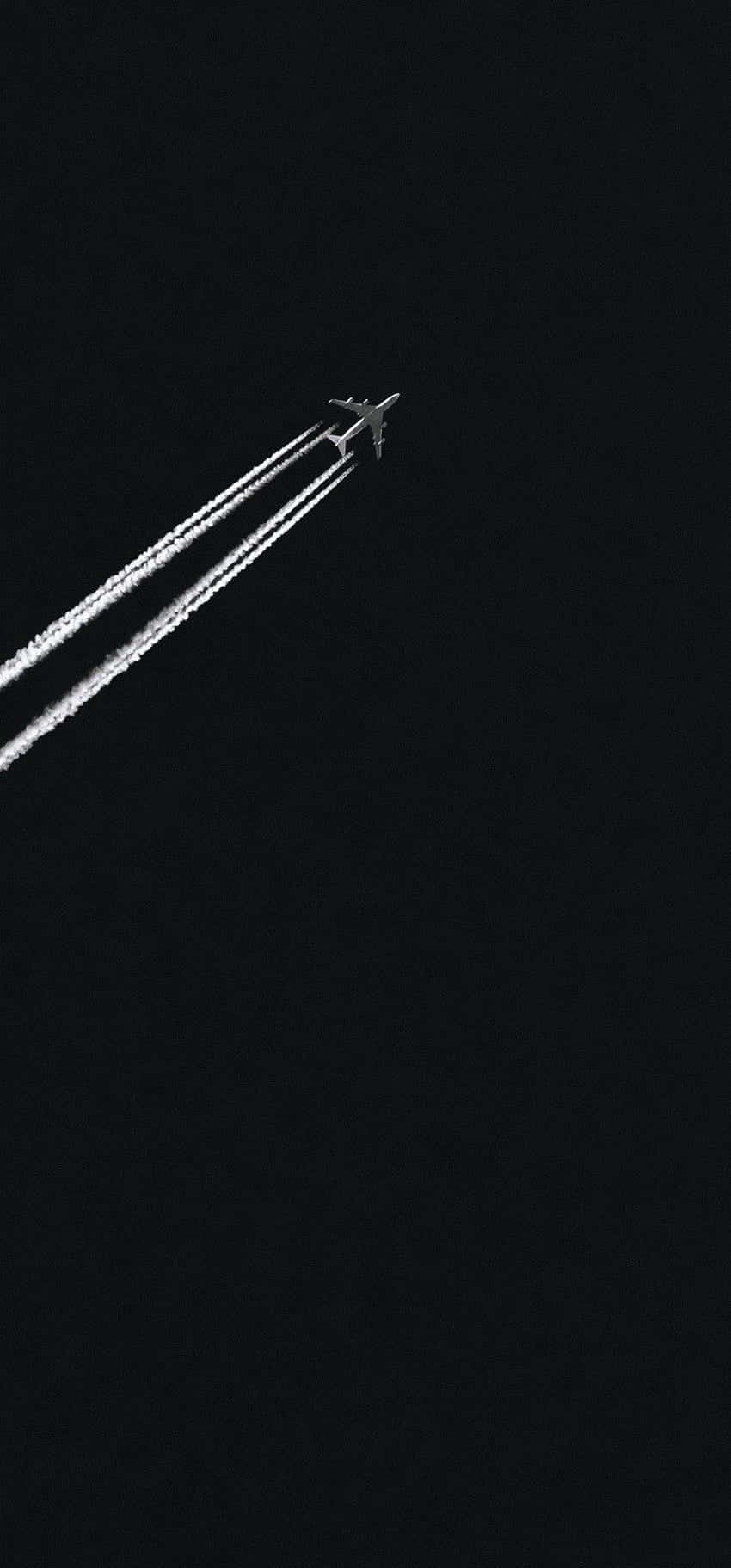 Jet_ Contrail_ Against_ Dark_ Sky Background