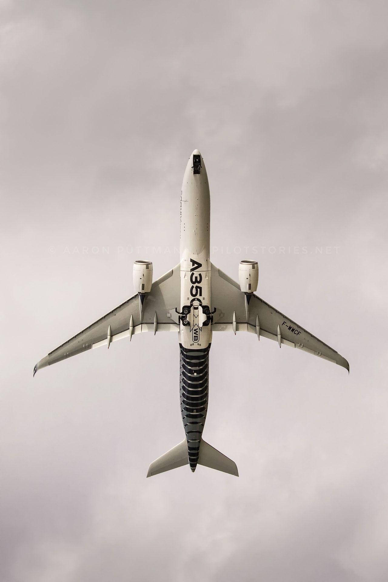 Jet Iphone Soaring Against Grey Sky Background