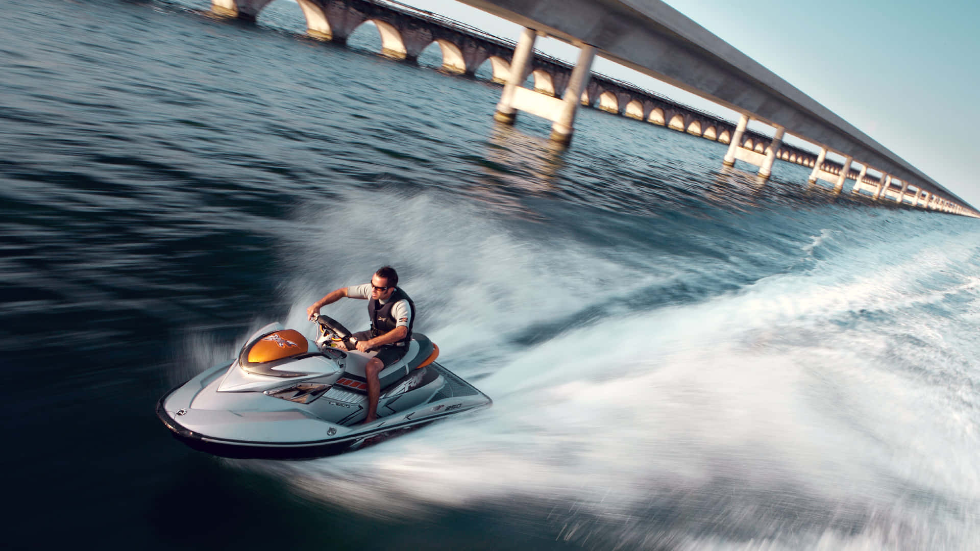 Jet Ski Near The Bridge Background