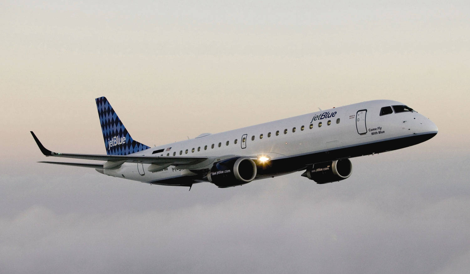 Jetblue Airplane Flight On Bright Sky Background