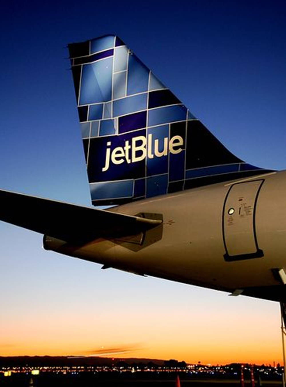 Jetblue Airways Airlines Logo On Plane Rudders Background