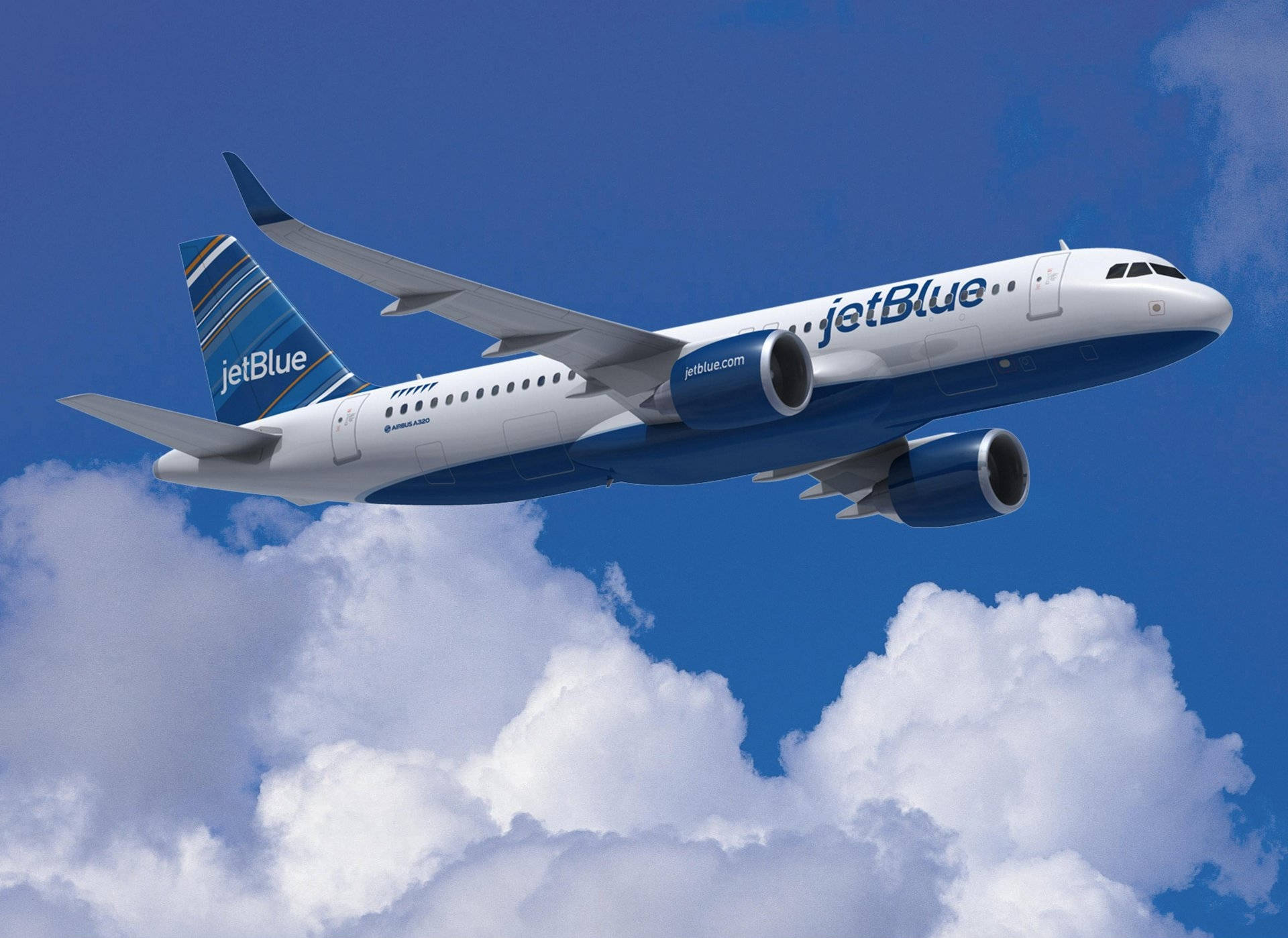 Jetblue Airways Airplane Flying By Clouds