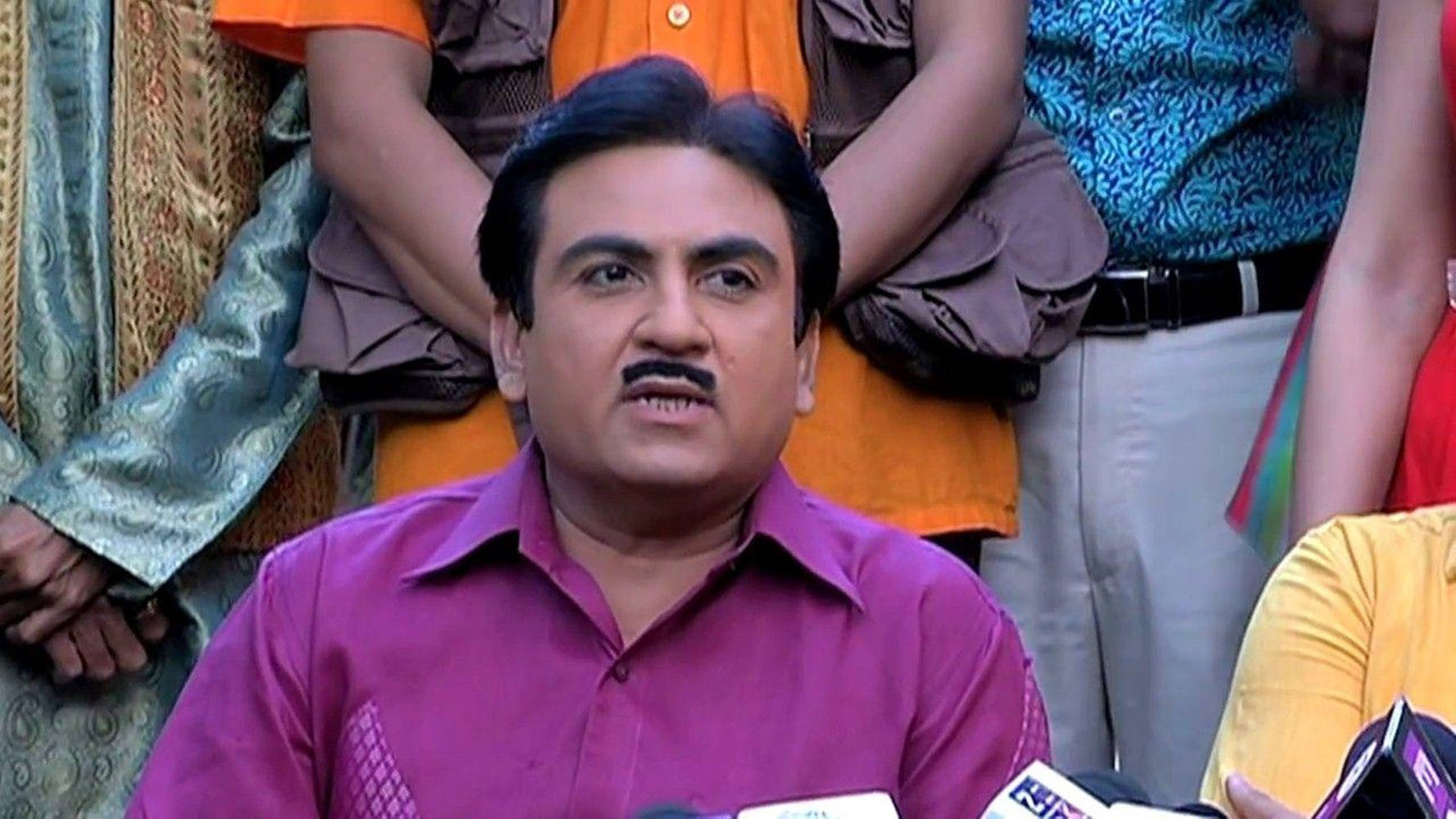 Jethalal In Purple Polo In An Interview Background