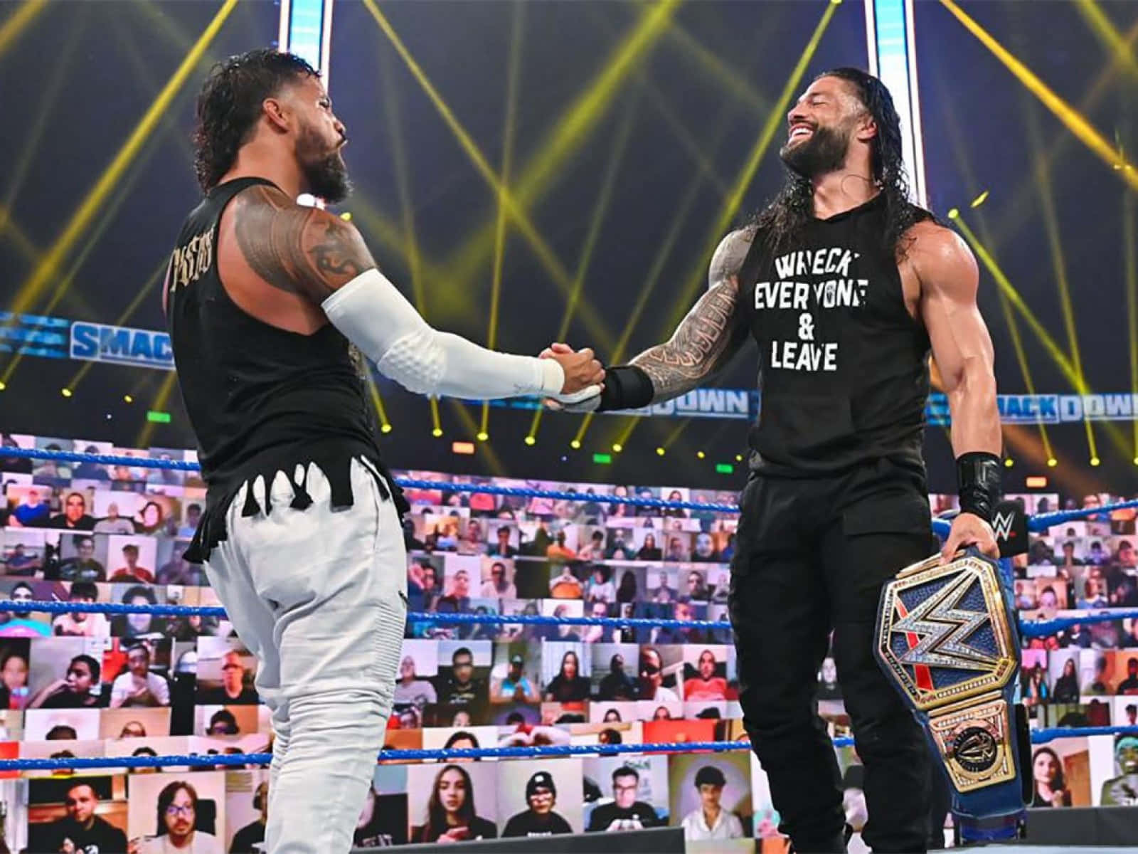 Jey Uso And Roman Reigns Handshaking Background