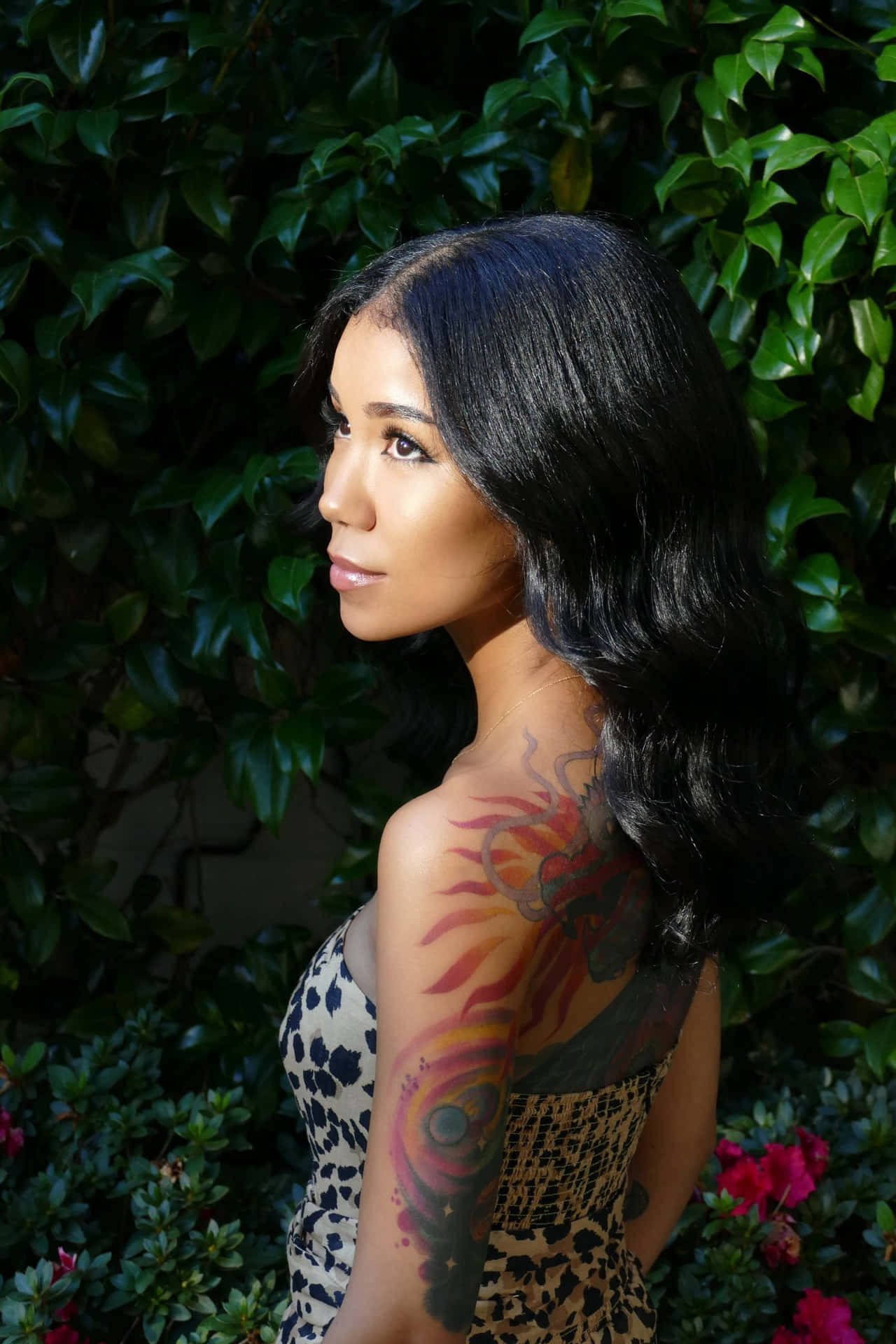 Jhene Aiko Dazzling In A Candid Pose Background