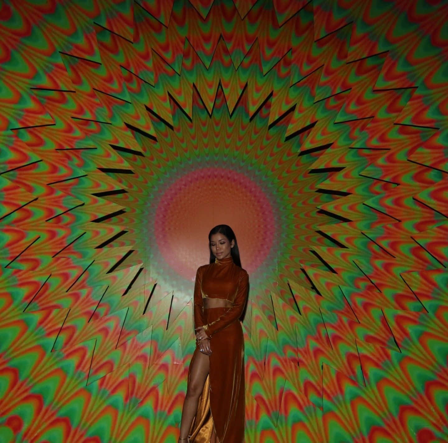 Jhene Aiko Posing Artistically In Colorful Dress Background