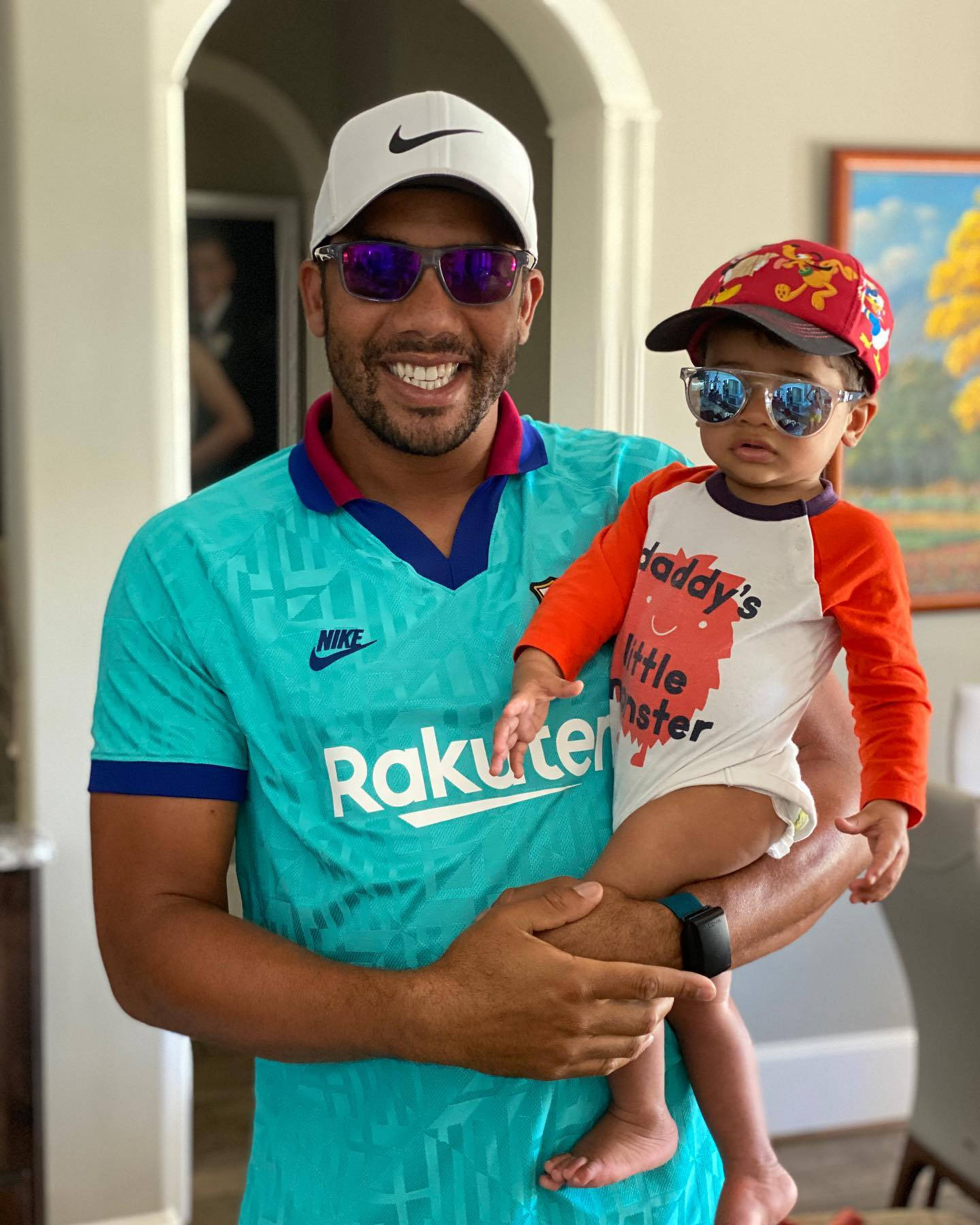 Jhonattan Vegas Smiling With His Child Background