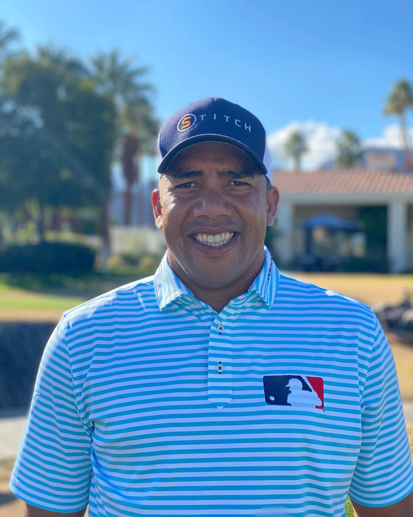 Jhonattan Vegas With A Bright Smile On The Golf Course Background