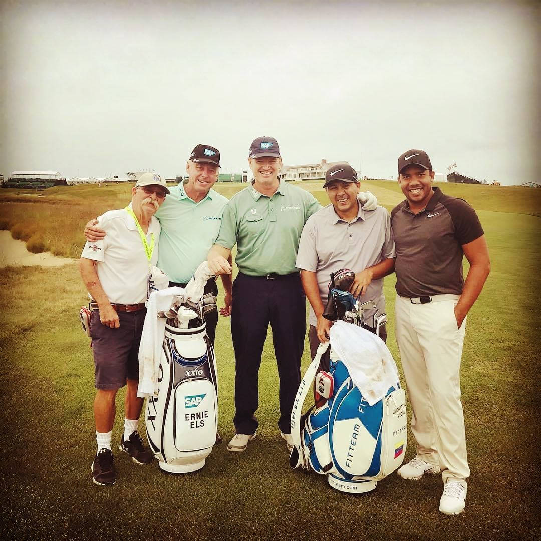 Jhonattan Vegas With Golfers And Caddie Background