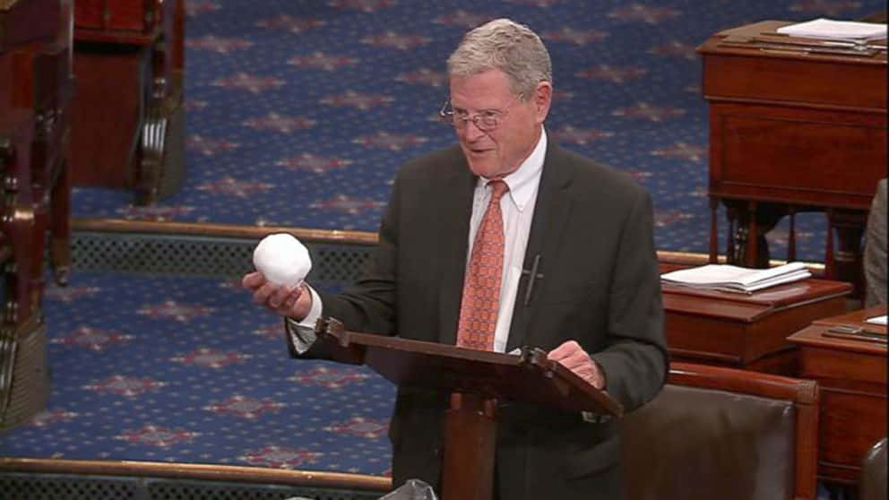Jim Inhofe Holding A Snowball Background