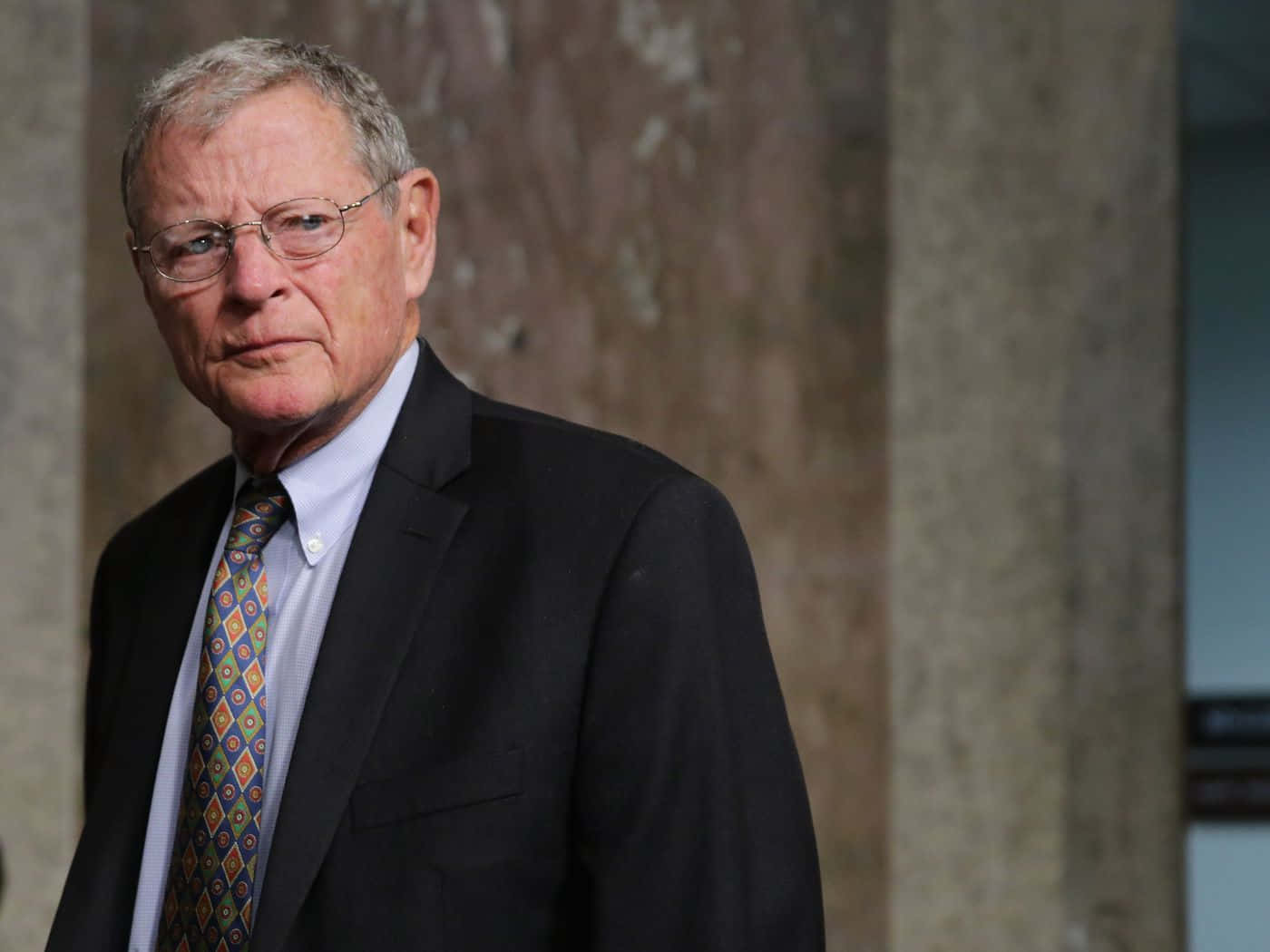Jim Inhofe With Serious Facial Expression Background