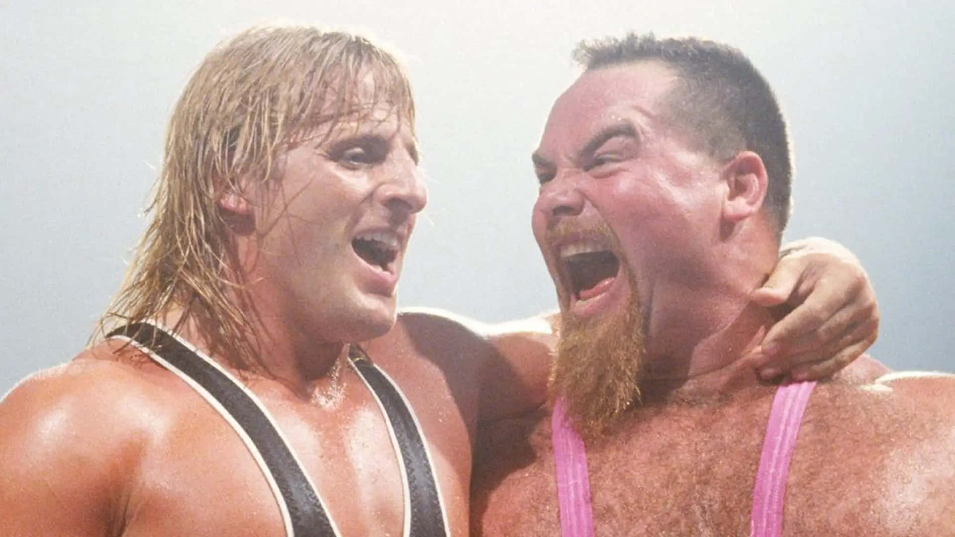 Jim Neidhart Laughing With Owen Hart Background