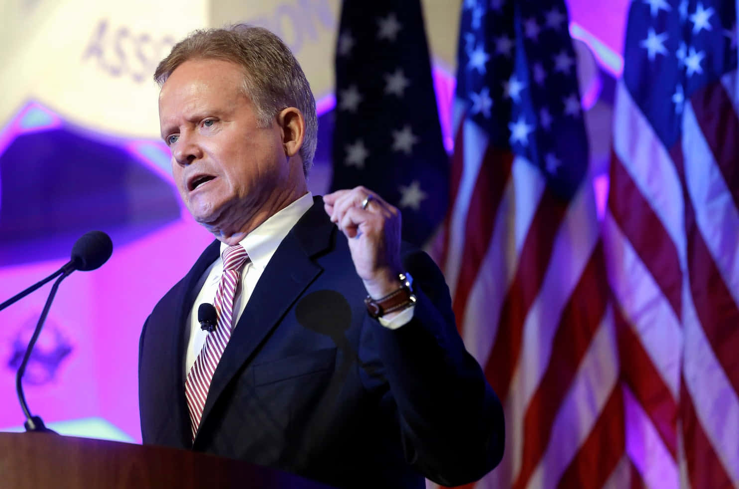 Jim Webb Delivering A Speech Background