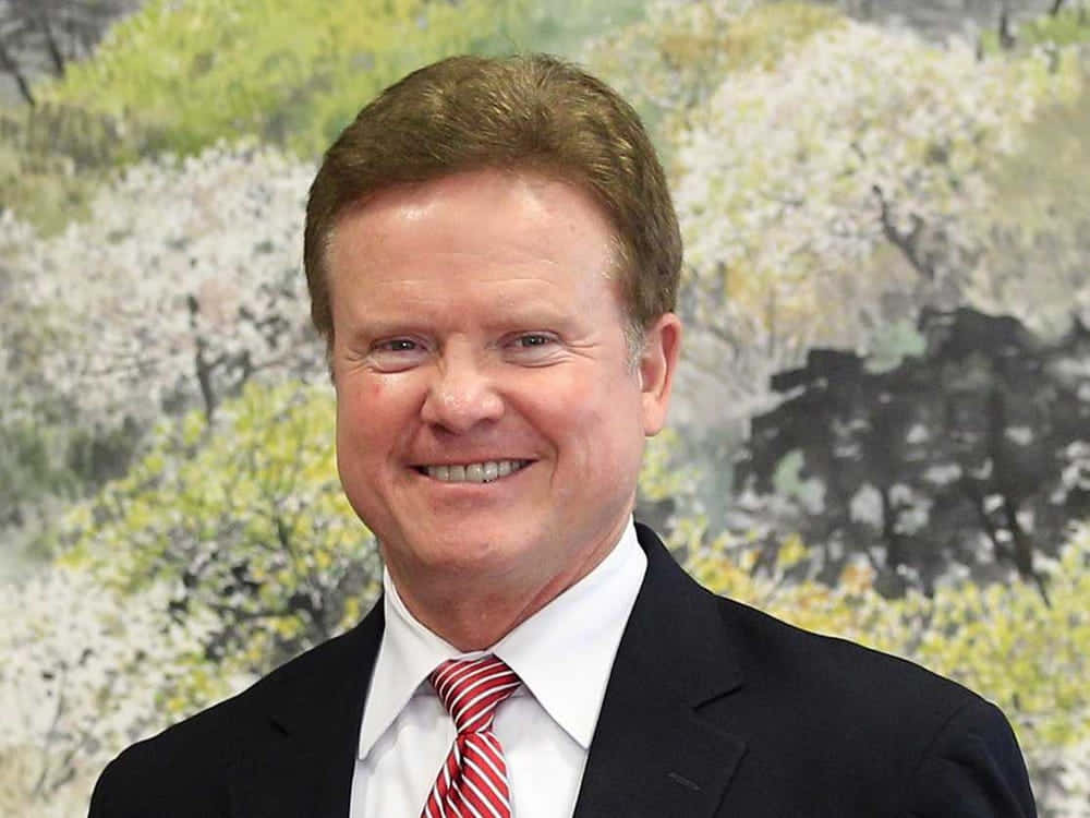 Jim Webb Gleeful Smile Background