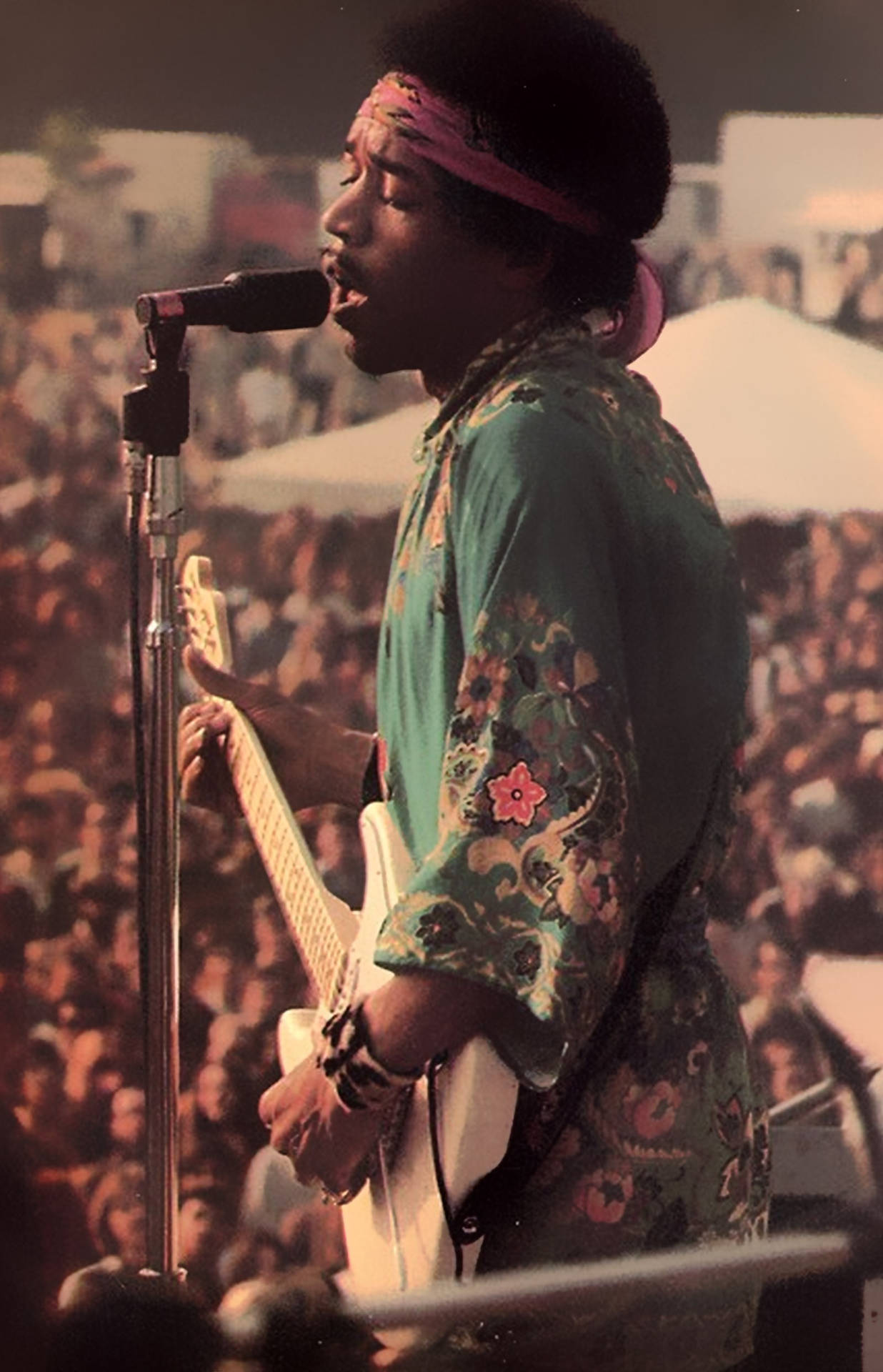 Jimi Hendrix Playing In Front Large Crowd Background