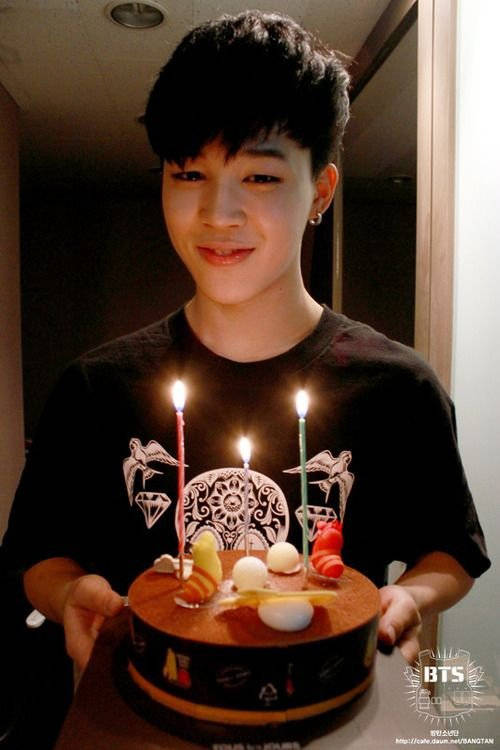 Jimin Of Bts Holds A Giant Cake Background