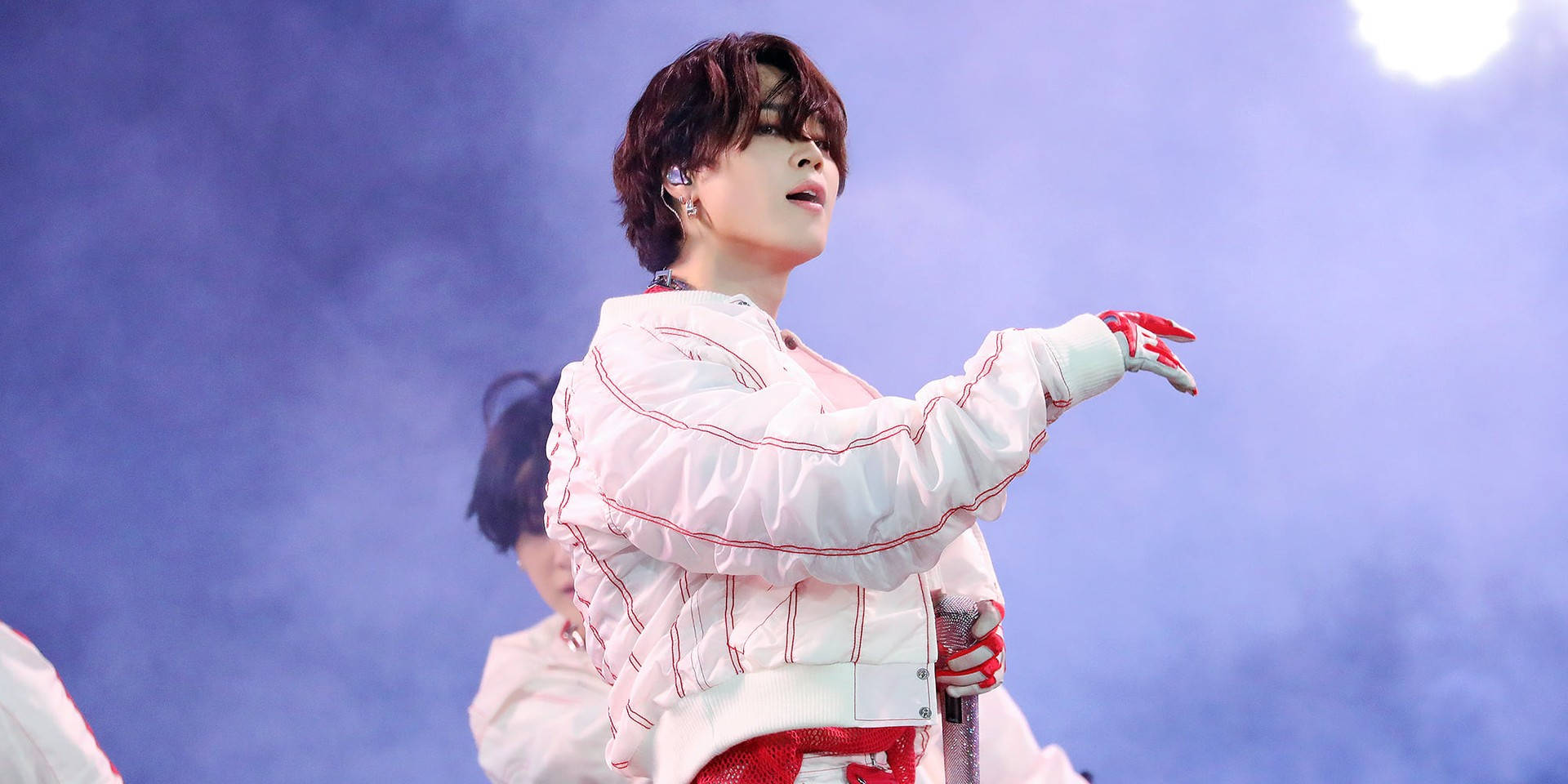 Jimin Of Bts Performing On Stage Background