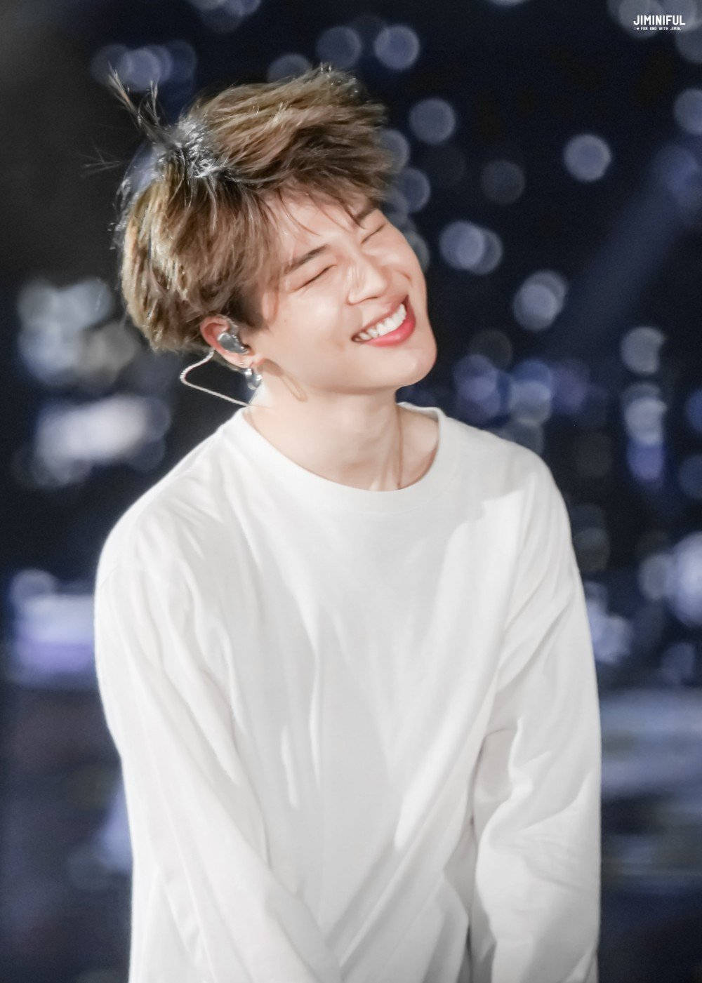 Jimin Of Bts Smiles At His Fans Onstage Background