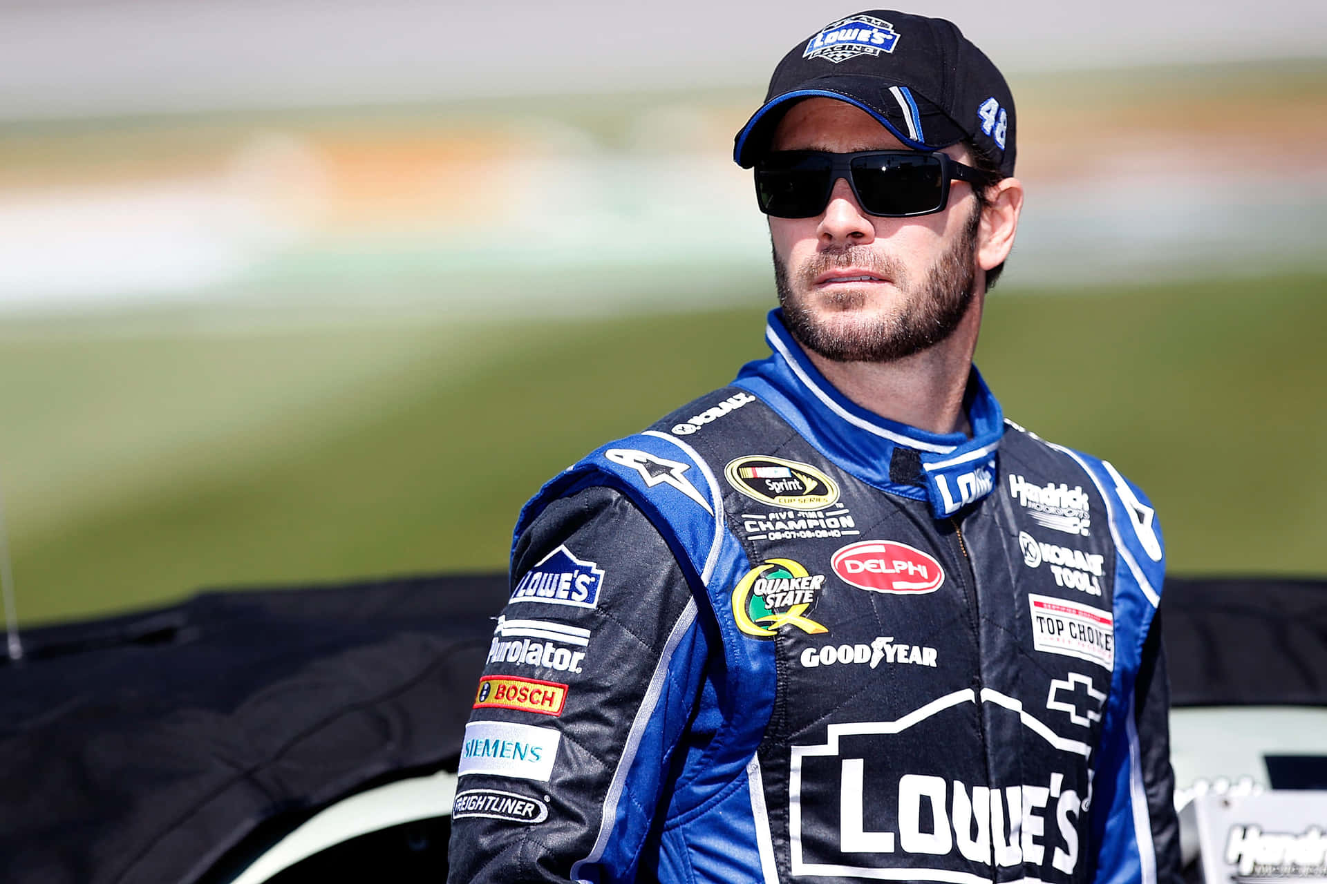 Jimmie Johnson Celebrating After A Race Win Background