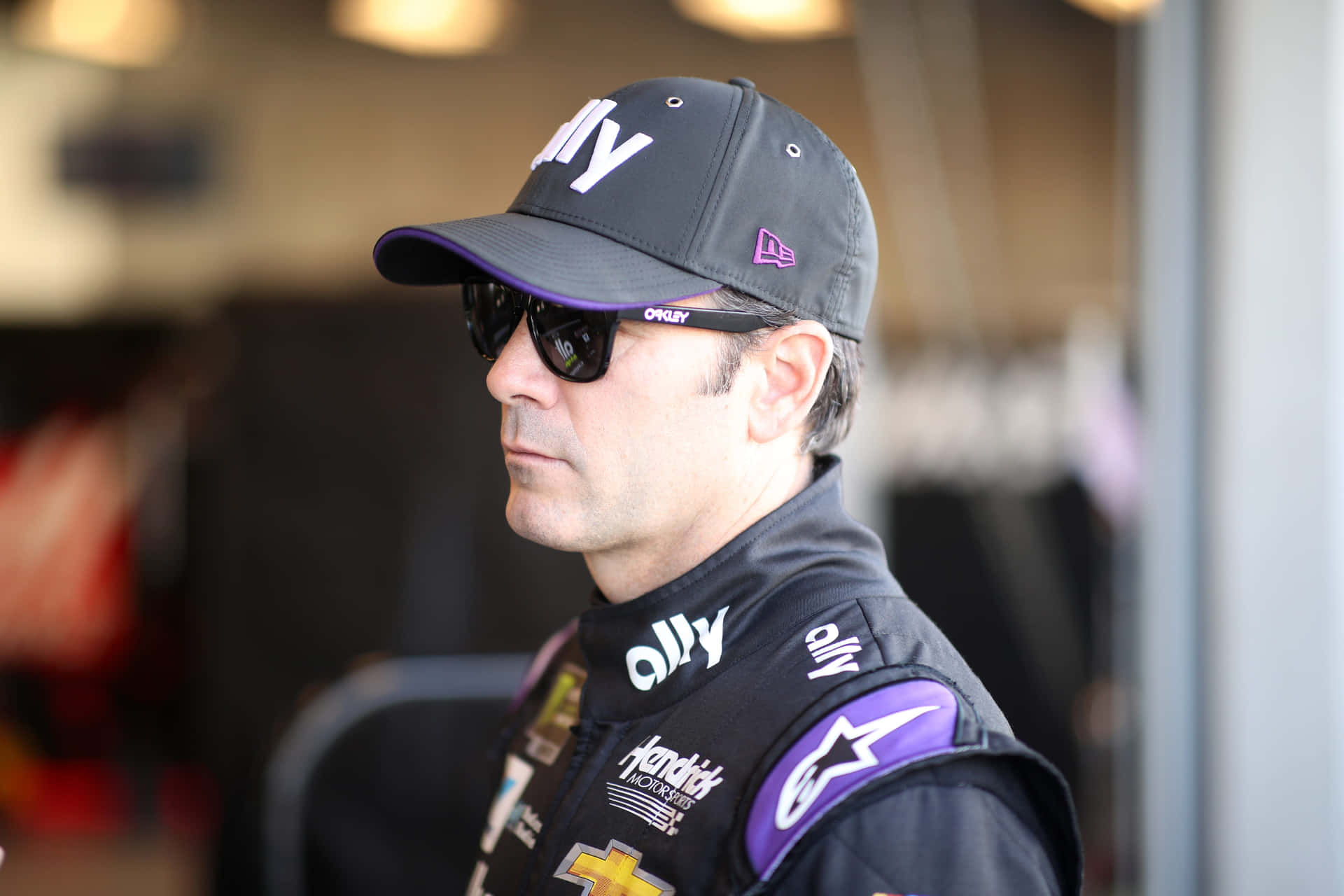 Jimmie Johnson In Action During A Nascar Race Background