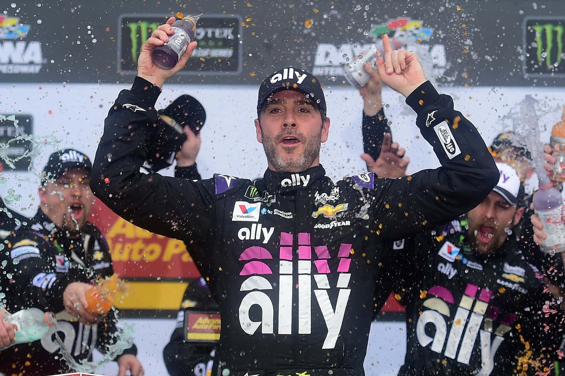 Jimmie Johnson Racing During A Nascar Event Background