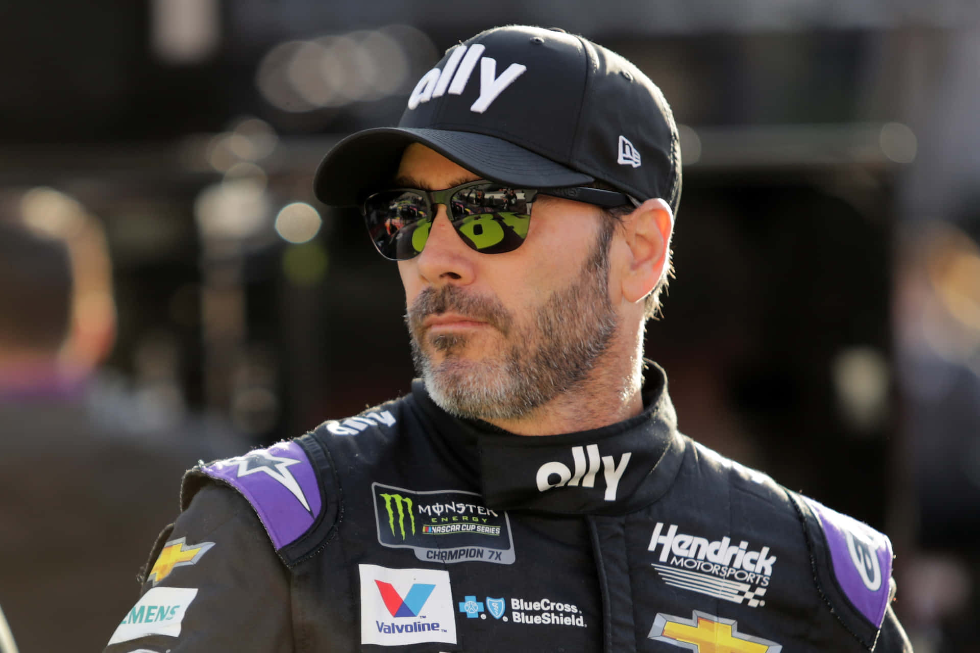 Jimmie Johnson Racing On The Track Background