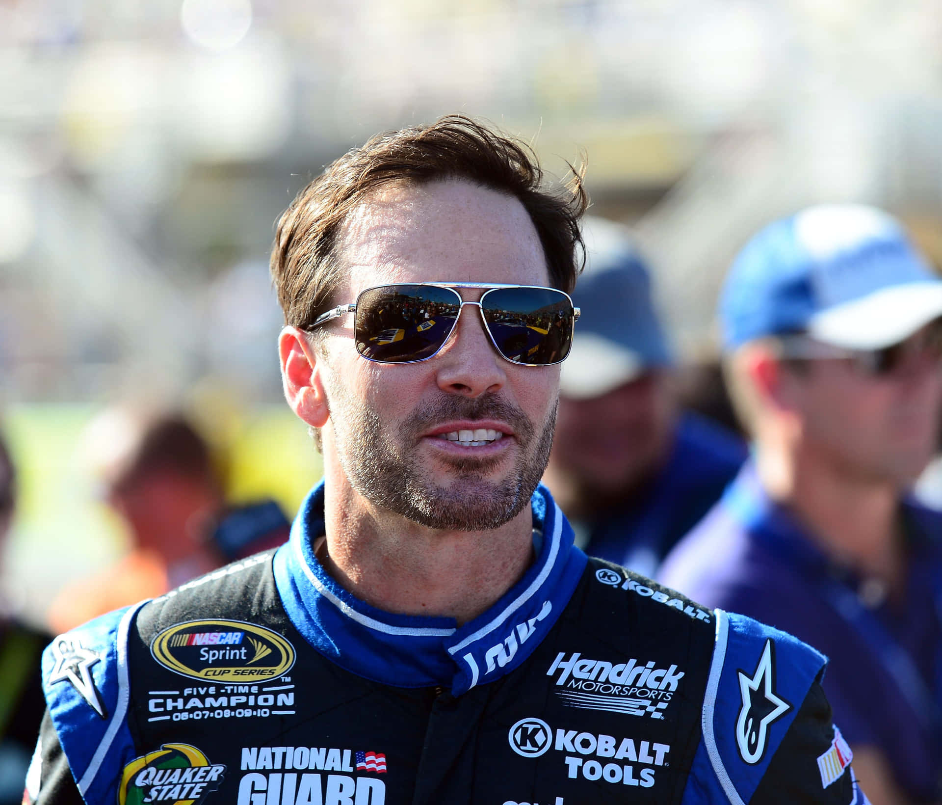 Jimmie Johnson Racing On The Tracks In His No. 48 Car Background