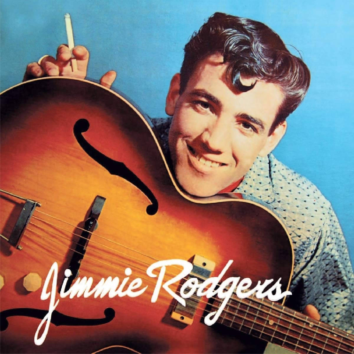 Jimmie Rodgers Modeling An Orange Guitar