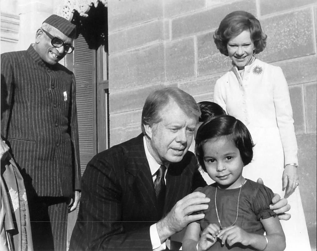 Jimmy Carter Approaches An Indian Girl Background