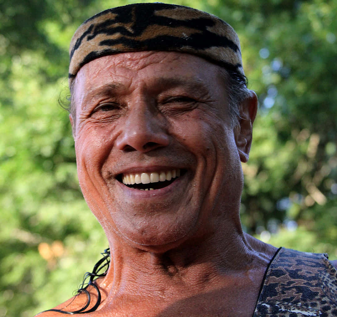 Jimmy Snuka Alluring Smile Background