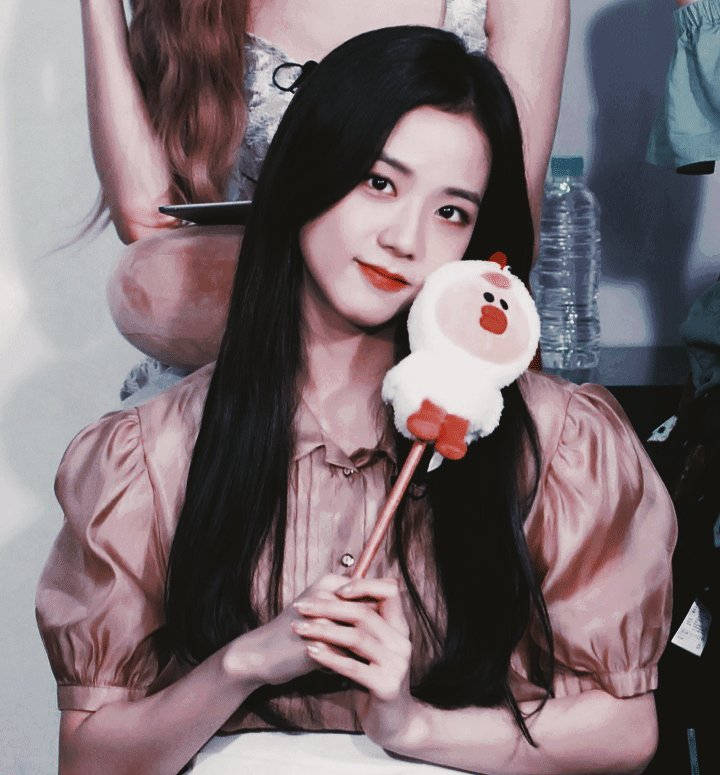 Jisoo Cute Holding A Stuffed Toy Background
