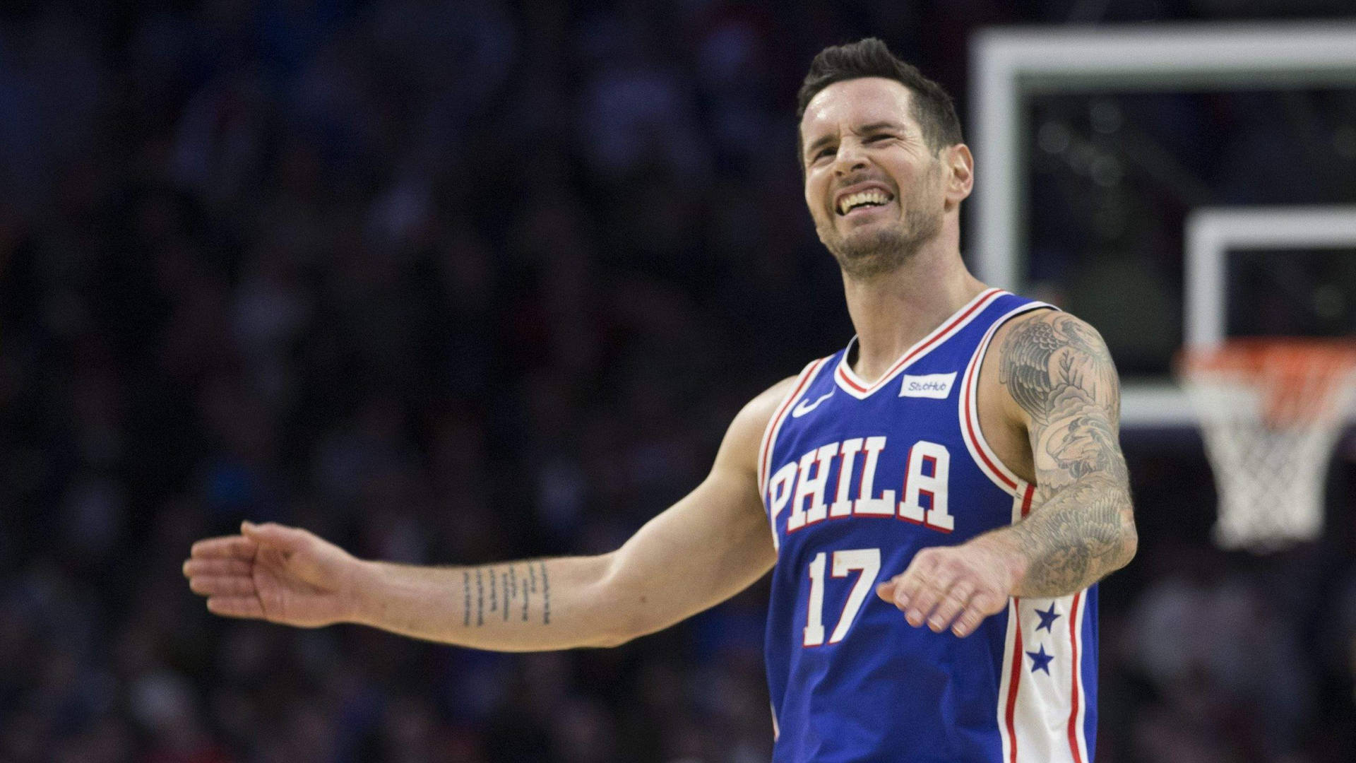 Jj Redick With A Cheerful Look Background