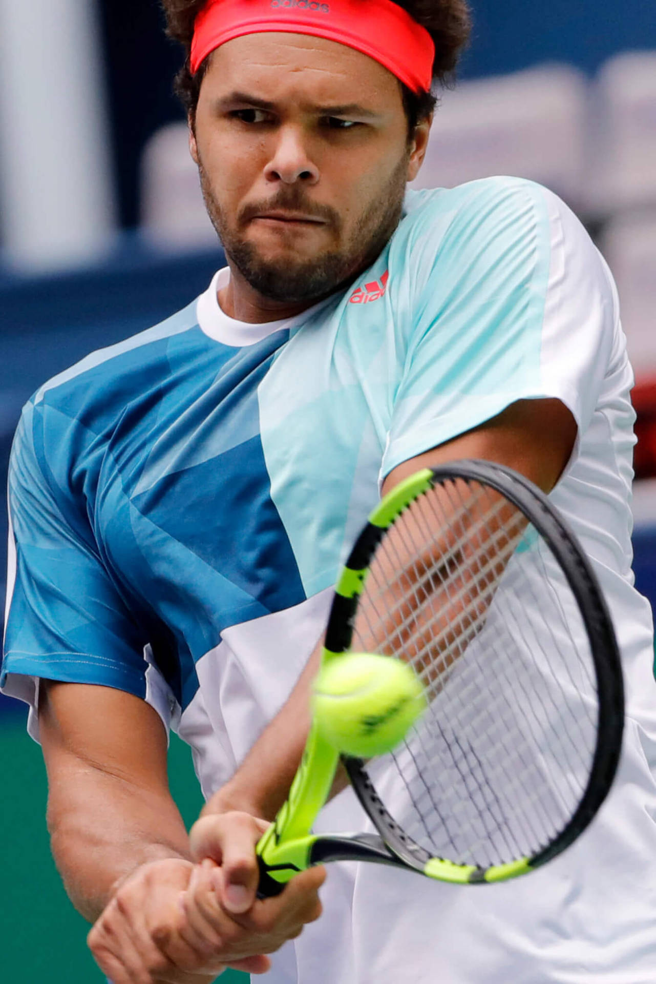 Jo-wilfried Tsonga Executing A Steady Tennis Stroke. Background