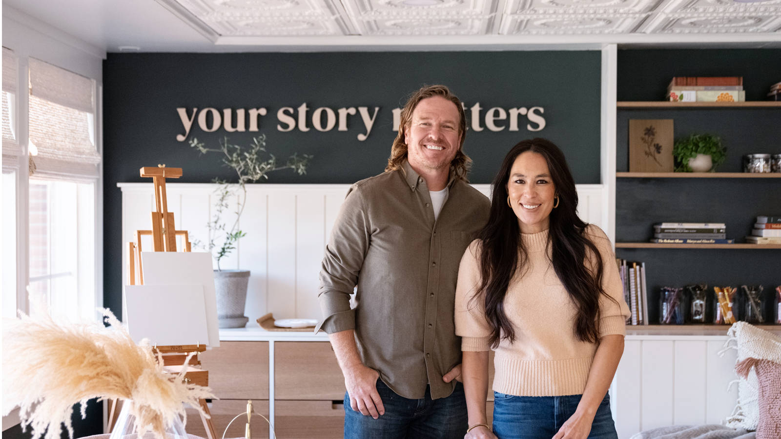 Joanna Gaines With Her Husband Chip Gaines On The Set Of Fixer Upper. Background
