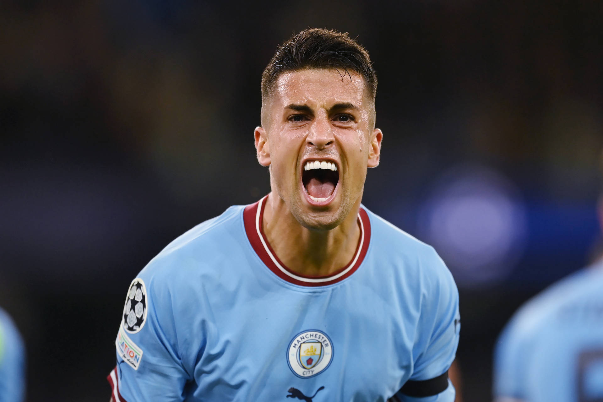 Joao Cancelo In Full Intensity On The Football Pitch Background