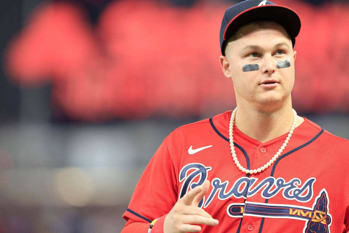 Joc Pederson In Red For Braves Background