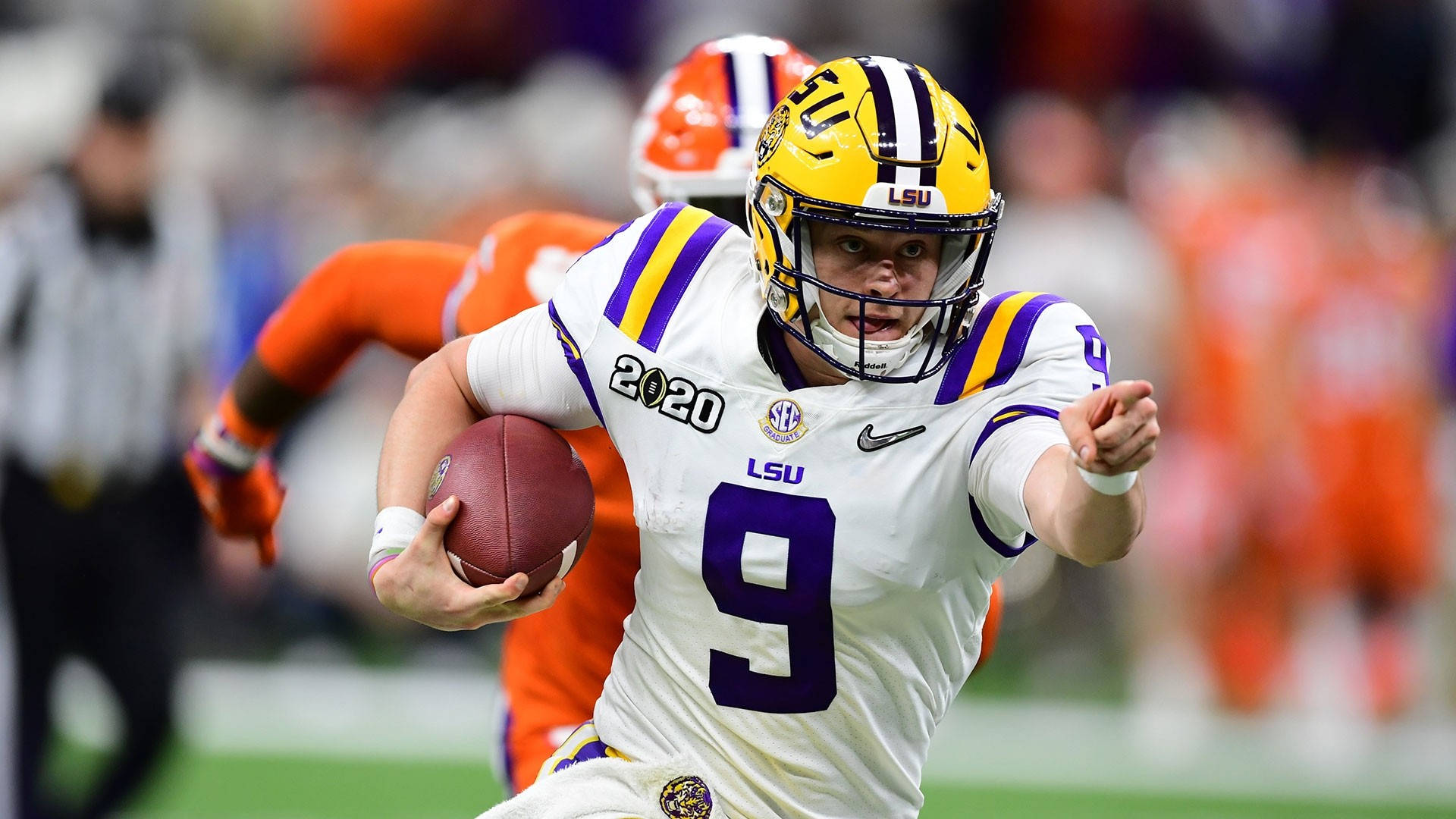 Joe Burrow Confidently Pointing During A Game Background
