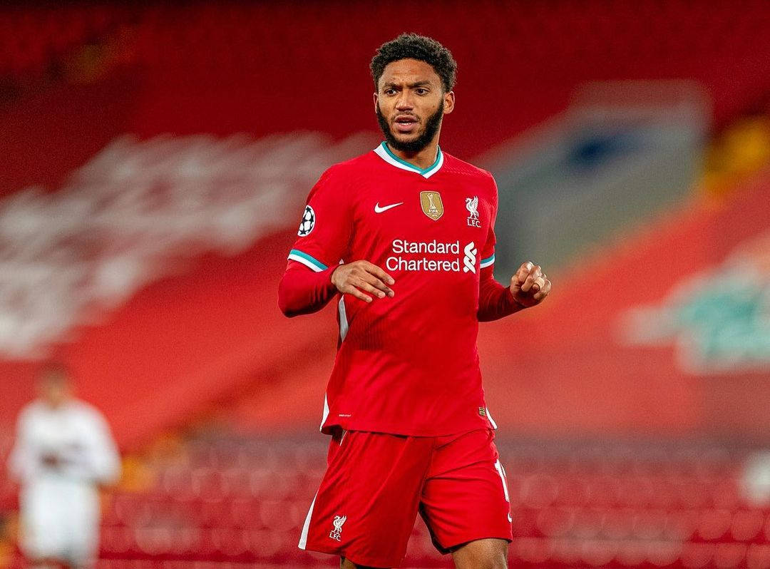 Joe Gomez Standing Inside Stadium Background