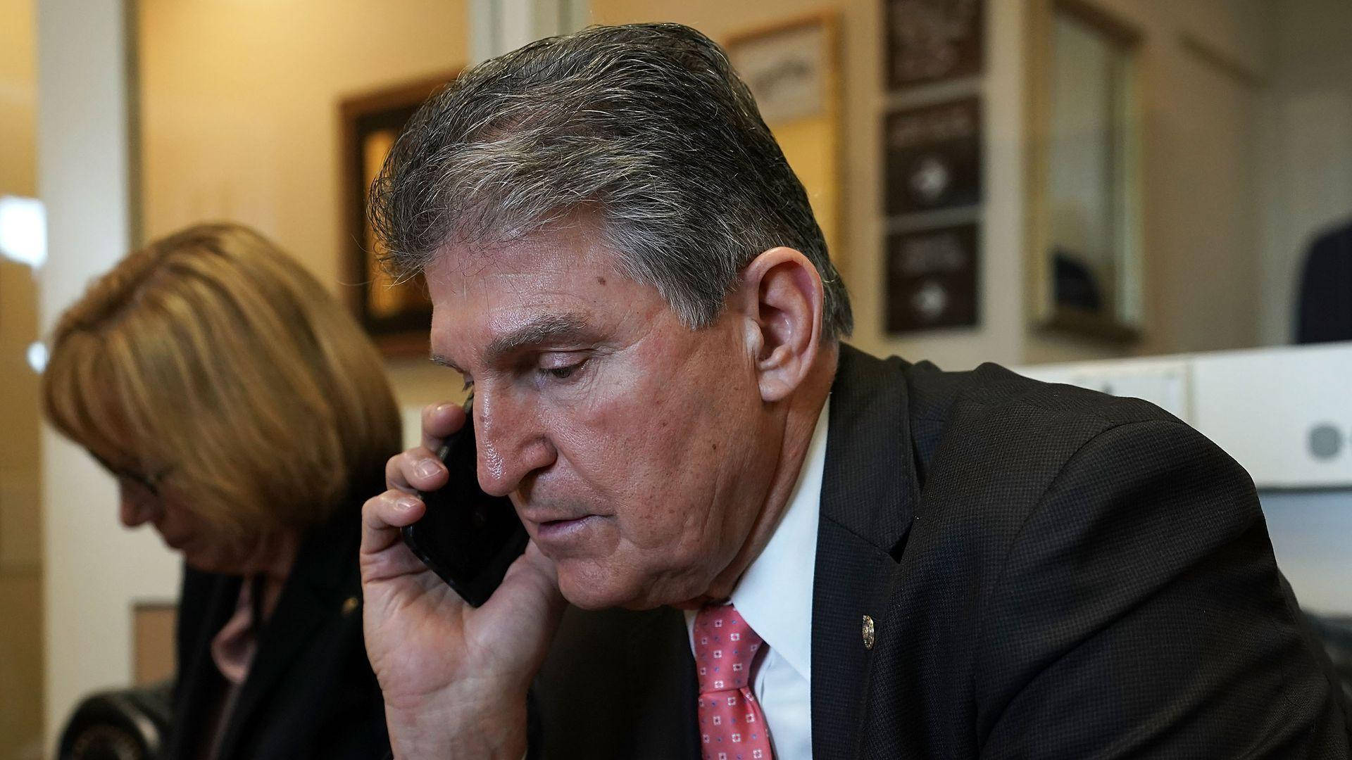 Joe Manchin Answering A Call Background