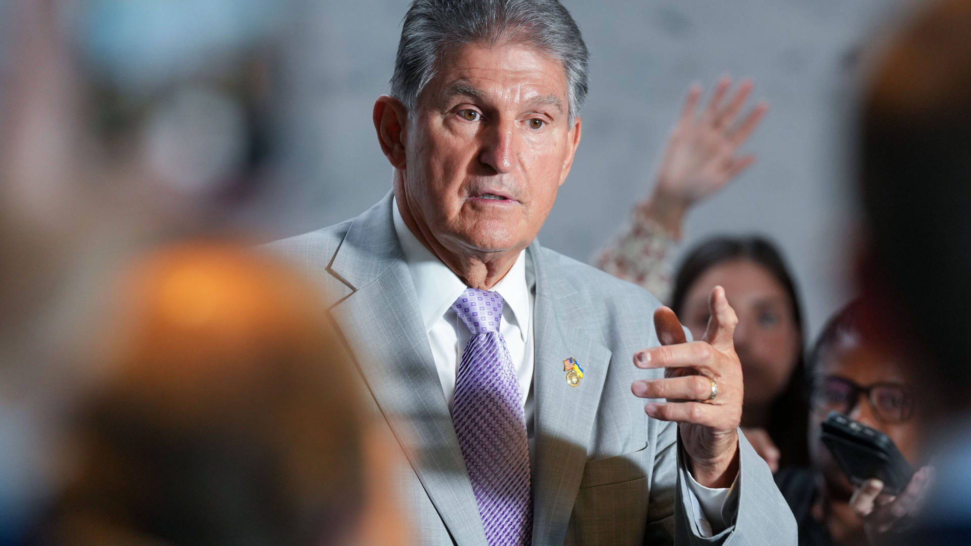 Joe Manchin In Front Of The Media Background