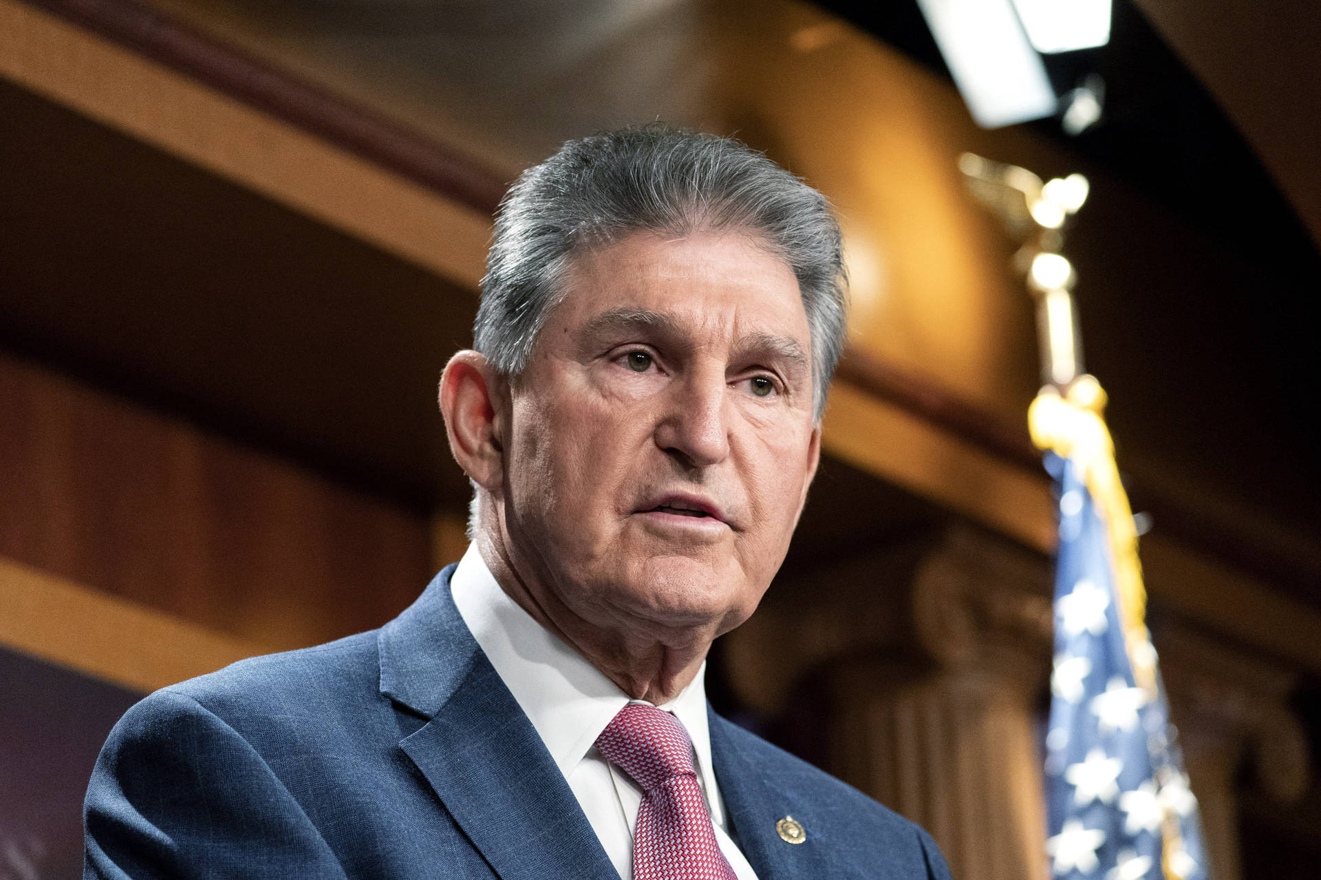 Joe Manchin Listening While Looking Background