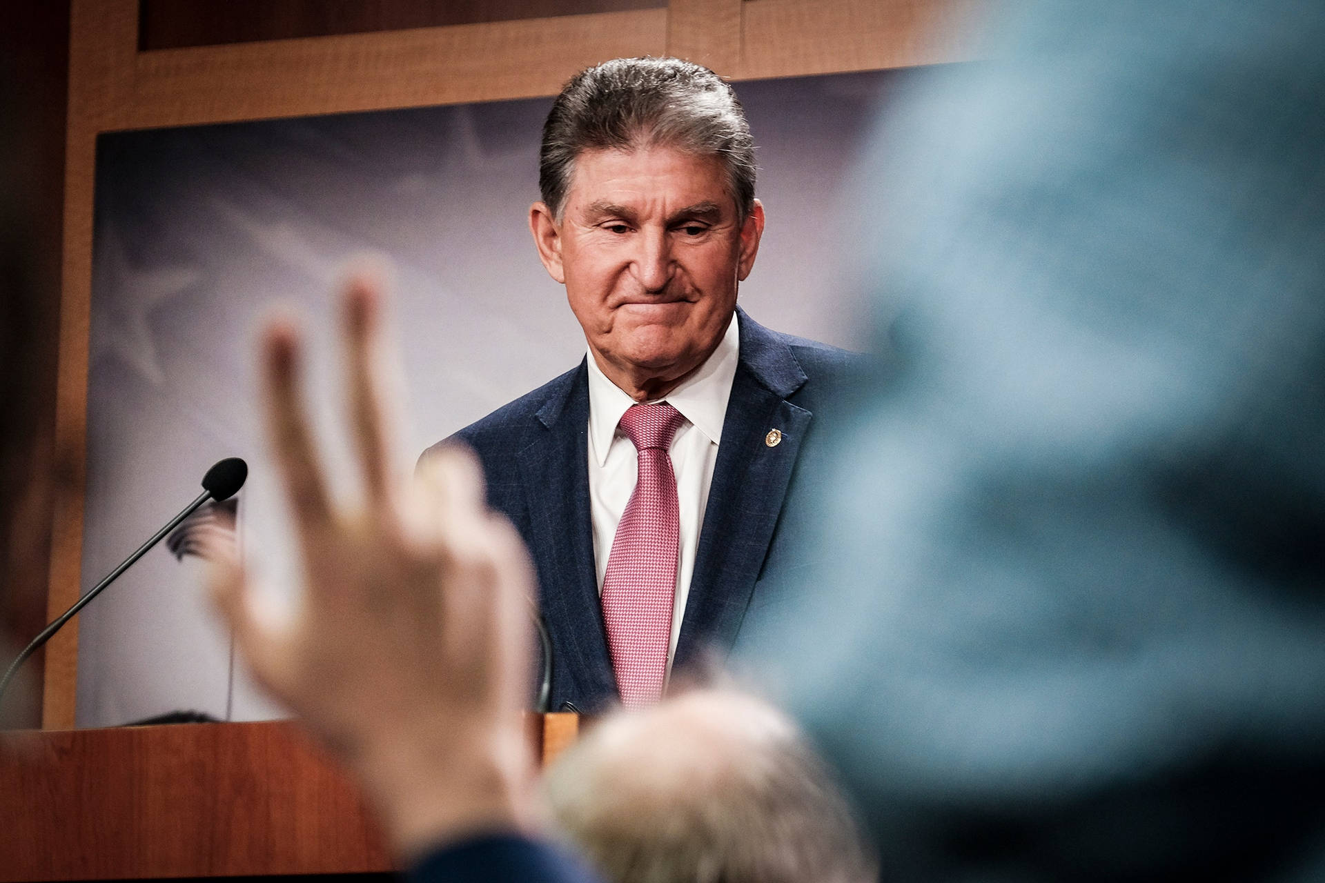 Joe Manchin Shy Smile Background