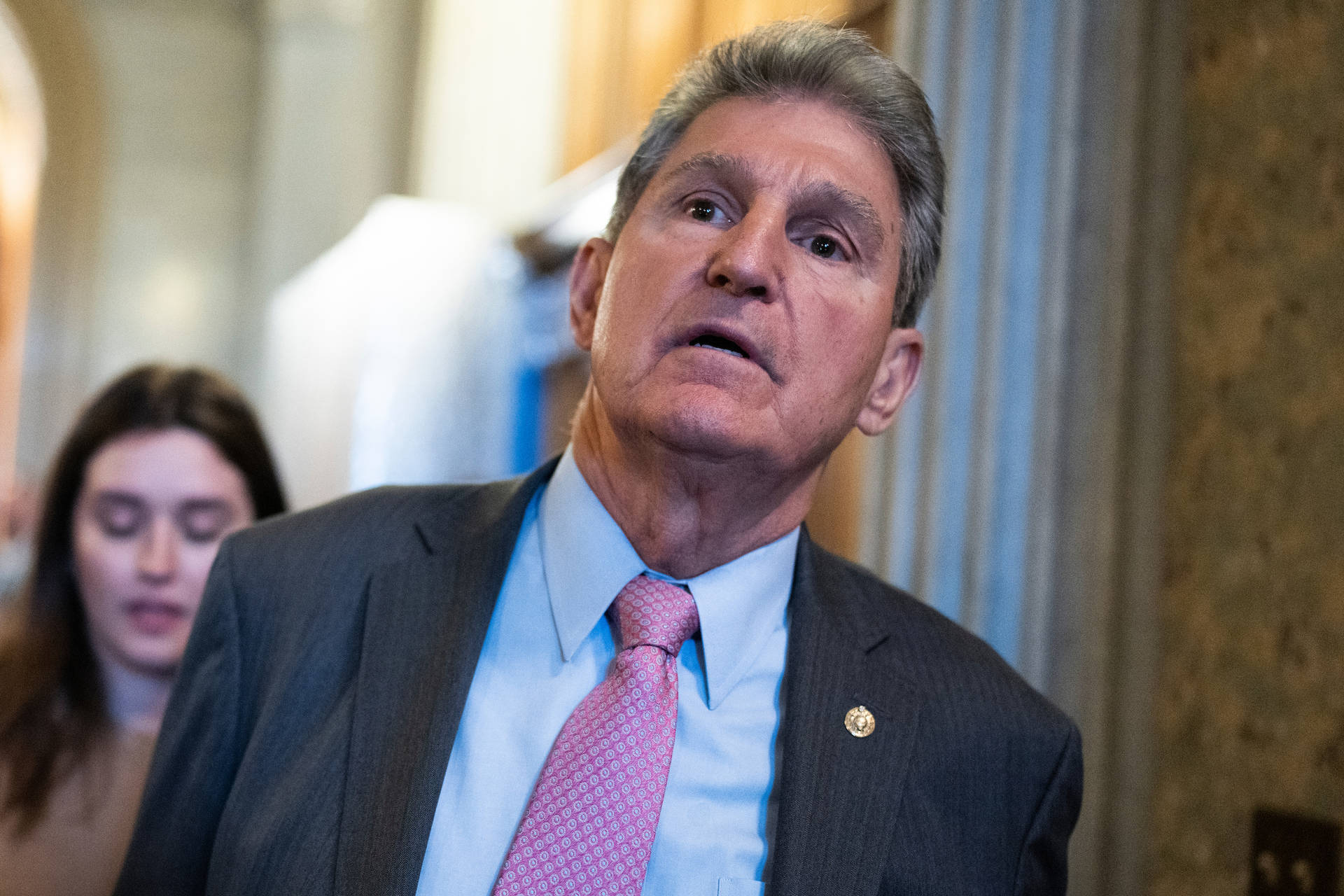 Joe Manchin Tiptoeing Background