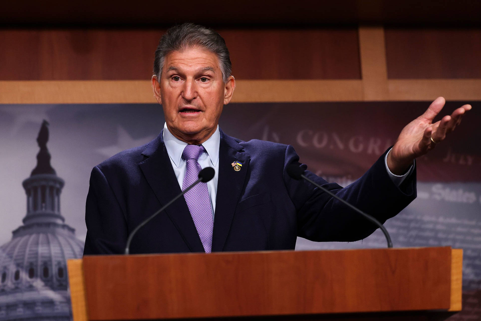 Joe Manchin Wearing A Purple Tie Background