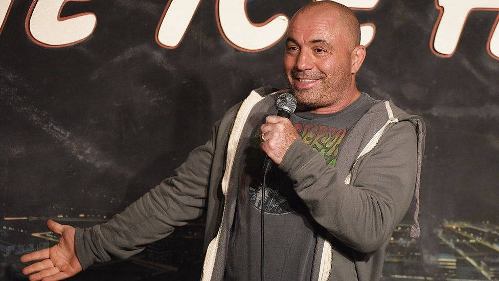 Joe Rogan - Comedian And Podcast Host In Action Background