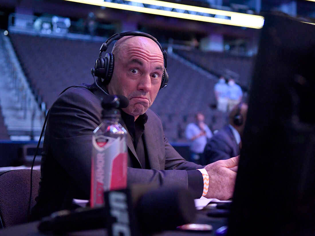 Joe Rogan Ringside Shrug Background