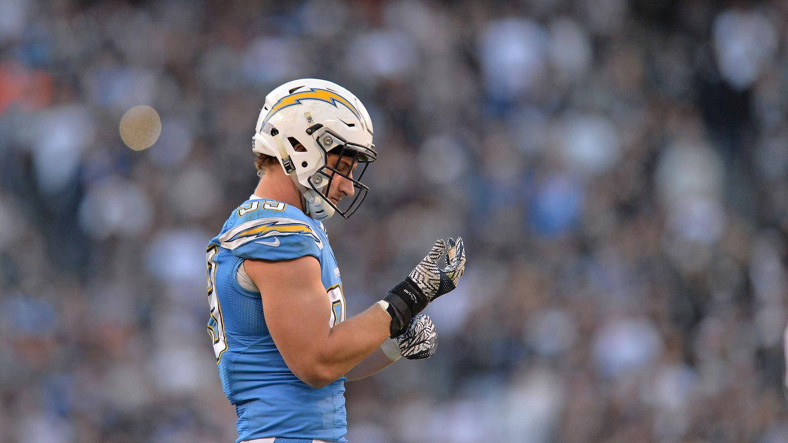 Joey Bosa Touching Nfl Moment Background